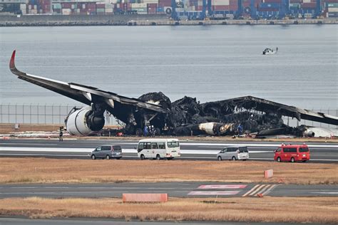 Plane burns on runway at Tokyo airport after collision, five reported dead